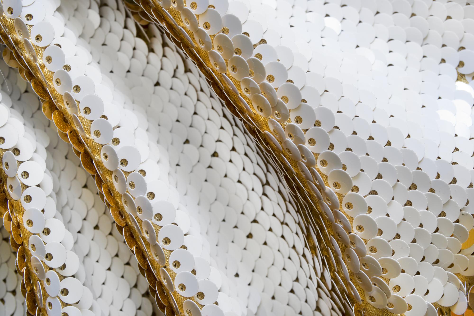 Close crop of metallic thread embroidery